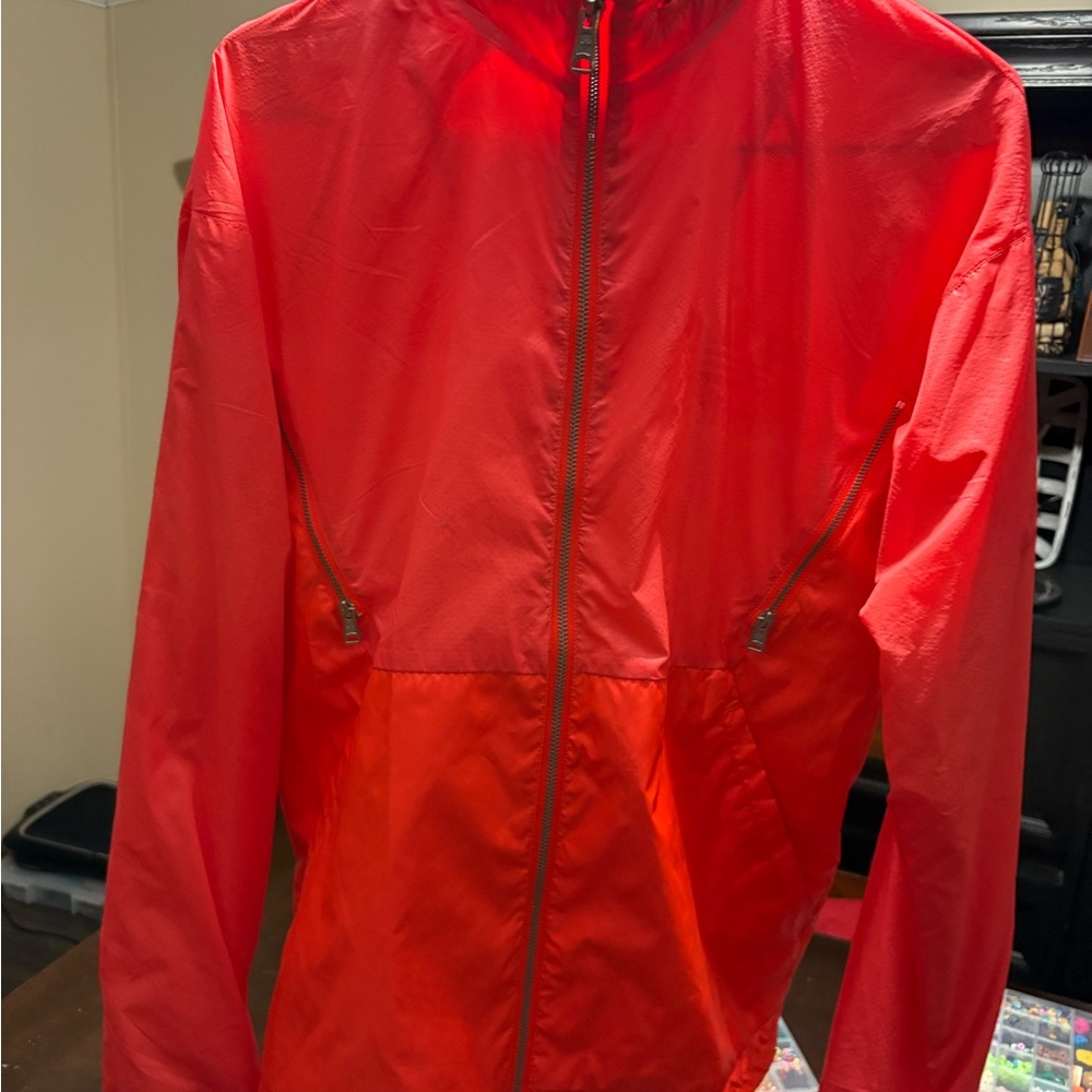 Bright Orange Full-Zip windbreaker Jacket with zipped up attached hoodie
